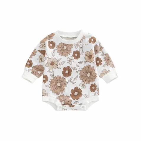 Cotton long sleeved baby romper with pink seventies floral pattern