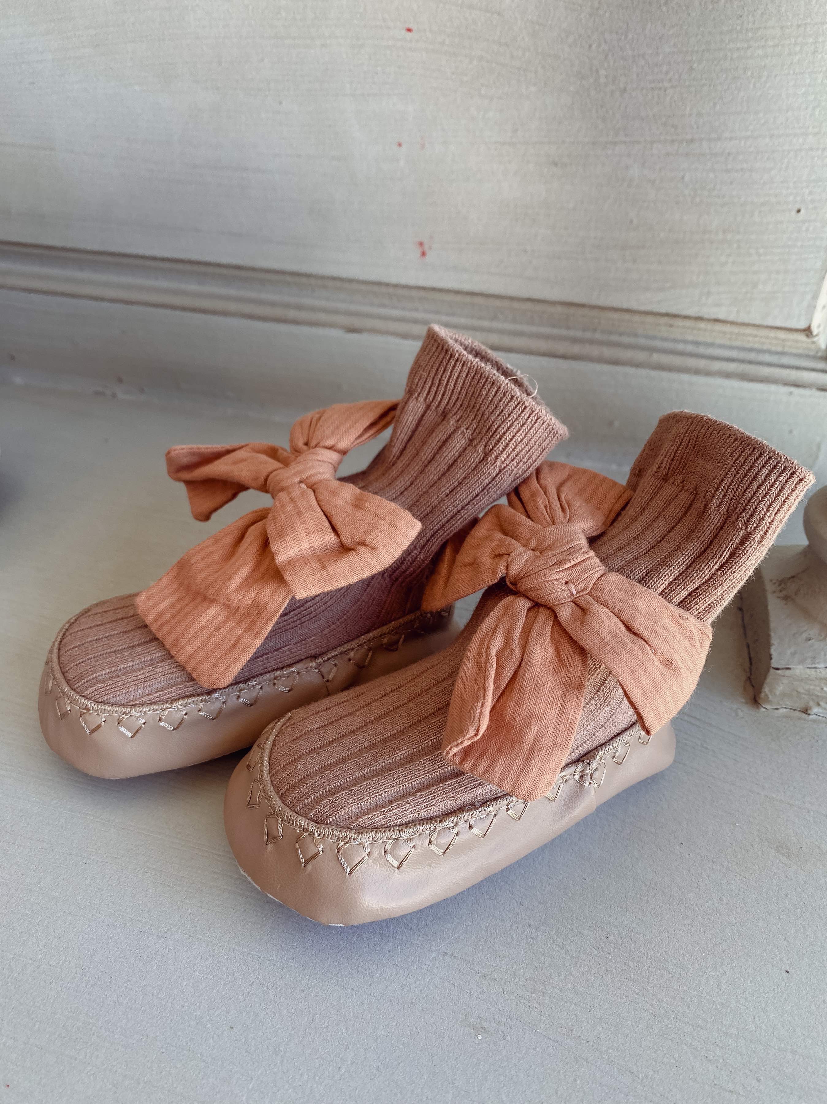 baby girl slippers with a big bow in apricot colour