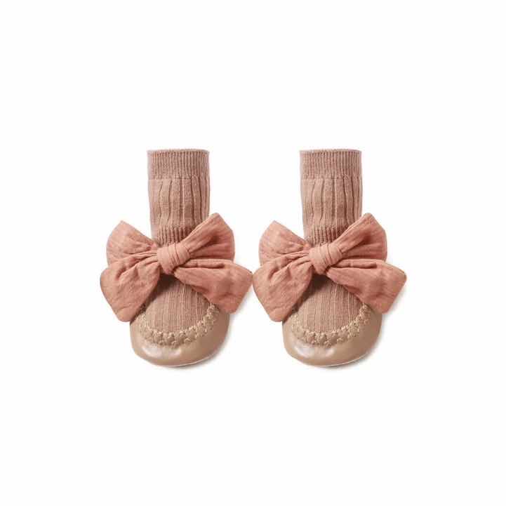 apricot colour girls sock slippers pre walker sock shoes with plastic sole for protection and big apricot bow on white background