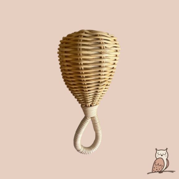 Rattan baby rattle. Cylinder shape top and oval handle at bottom.