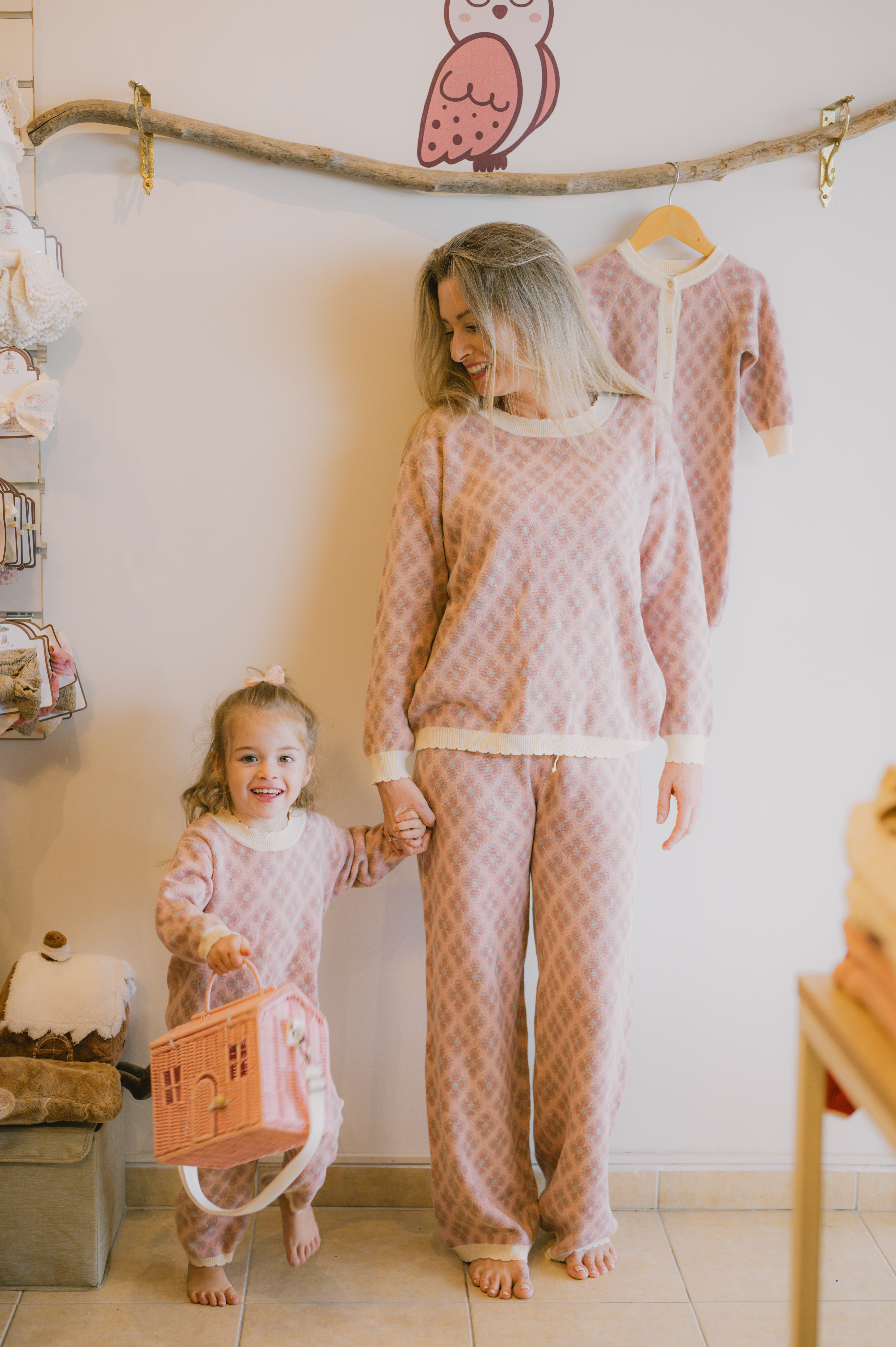 Mommy and her daughter wearing matching clothes. Part of the exclusive Baby Owl winter collection. Fine knitted dusty pink set with pink flowers and mint centres. Cream scalloped edges